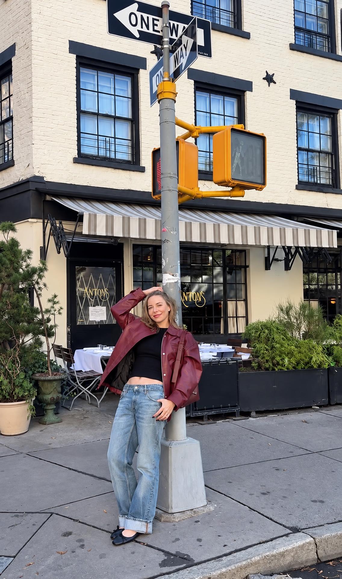 Anne on a New York street in a burgundy jacket